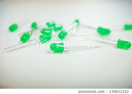 Green light emitting diodes on white background 130622202