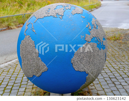 Miniature earth sculpture on urban sidewalk street 130623142