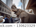 A large elephant in business district of city surrounded by people on street 130623329