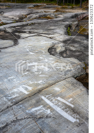 Prehistoric rock carvings, vertical view of petroglyphs, ancient art scenes on stone in Zalavruga Prehistoric rock carvings, vertical view of petroglyphs, ancient art scenes on stone in Zalavruga 130623372