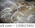 Ancient rock art petroglyphs on stone surface, prehistoric carved drawing near Belomorsk, Karelia 130623402