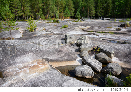 Rocky landscape with ancient rock art, stones and water in northern forest, prehistoric drawing in Zalavruga, nature of Russia Rocky landscape with ancient rock art, stones and water in northern forest, prehistoric drawing in Zalavruga, nature of Russia 130623404