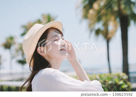 Young woman enjoying sightseeing at a resort Young woman enjoying sightseeing at a resort 130623592