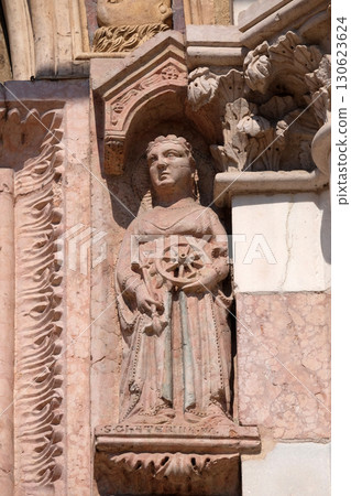 Saint Catherine of Alexandria, statue on Facade of Sant`Anastasia Church in Verona, Italy 130623624