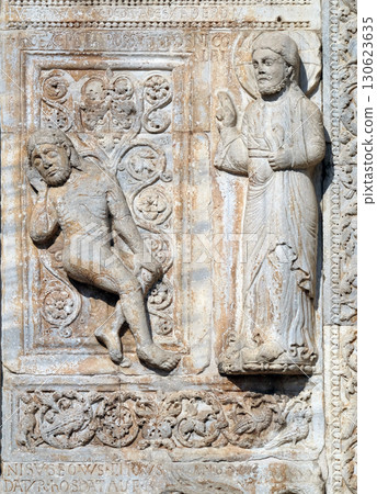 Creation of Adam, medieval relief on the facade of Basilica of San Zeno in Verona, Italy 130623635