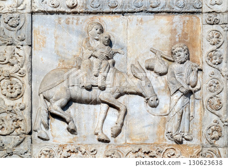 Flight ot Egypt, medieval relief on the facade of Basilica of San Zeno in Verona, Italy Flight ot Egypt, medieval relief on the facade of Basilica of San Zeno in Verona, Italy 130623638