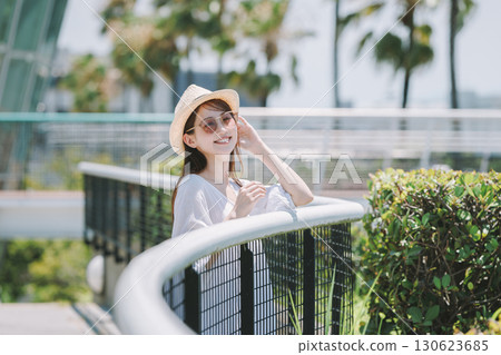 Young woman enjoying sightseeing at a resort 130623685