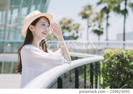 Young woman enjoying sightseeing at a resort 130623691