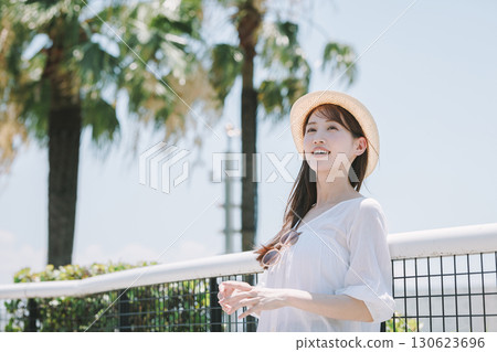 Young woman enjoying sightseeing at a resort 130623696