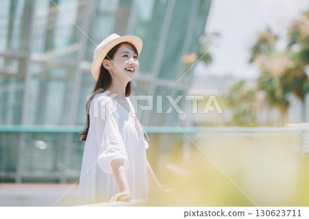 Young woman enjoying sightseeing at a resort Young woman enjoying sightseeing at a resort 130623711