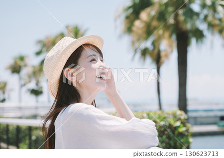 Young woman enjoying sightseeing at a resort 130623713