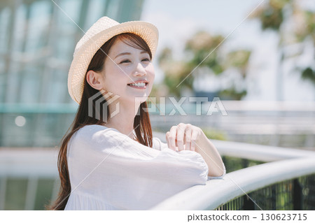 Young woman enjoying sightseeing at a resort Young woman enjoying sightseeing at a resort 130623715