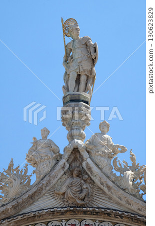 Statue of Saint, detail of the facade of the Saint Mark's Basilica, St. Mark's Square, Venice, Italy 130623829