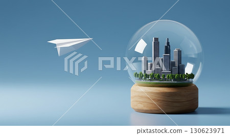 Miniature Cityscape Inside Glass Globe with Paper Plane in Conceptual Scene 130623971