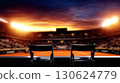 Dramatic night tennis match under bright floodlights with empty blurred stadium. Sport competition background concept for advertising poster tournament or motivational training design 130624779
