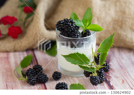 Close-up of yogurt with berries and strawberries Close-up of yogurt with berries and strawberries 130624902