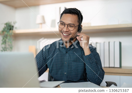 Smiling Call Center Agent Providing Excellent Customer Service 130625387