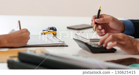 Car Insurance Process. Close-up of hands during a consultation. 130625415