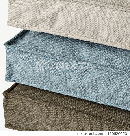 Stack of soft furnishing floor cushions in neutral colors 130626050