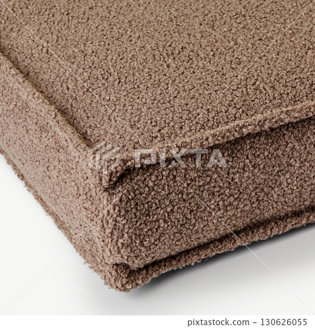 Close-up of corner of soft brown boucle cushion showing texture Close-up of corner of soft brown boucle cushion showing texture 130626055
