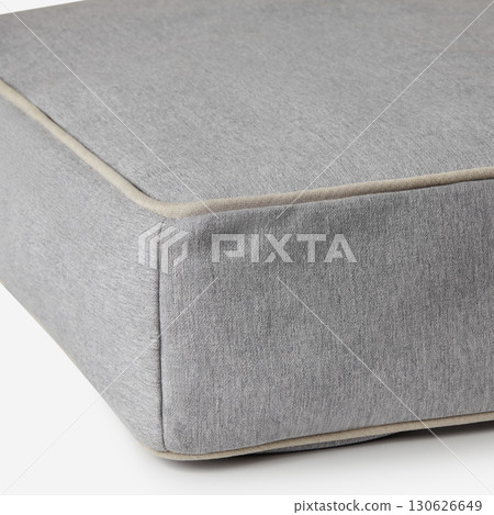 Gray fabric upholstery detail showing stitching and piping 130626649
