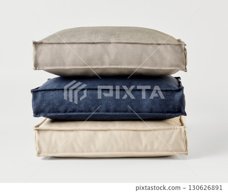 Stack of three cushions forming a relaxing pile on white background Stack of three cushions forming a relaxing pile on white background 130626891