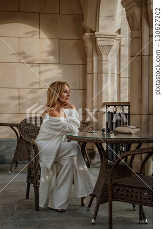 Woman White Outfit Cafe Table Outdoor Sitting Relaxing Woman White Outfit Cafe Table Outdoor Sitting Relaxing 130627202