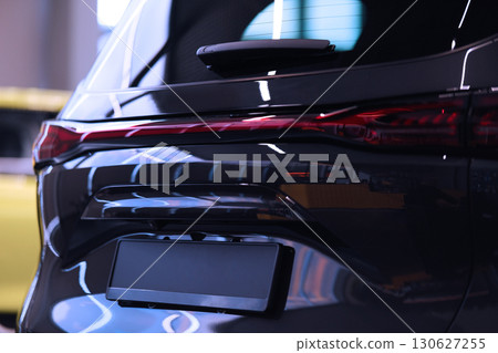 The body of a new car. Rear view. Car in the store showroomHigh quality photo 130627255