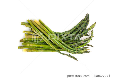Cooked asparagus isolated. Roasted green vegetable for salad, baked asparagus bunch Cooked asparagus isolated. Roasted green vegetable for salad, baked asparagus bunch 130627271