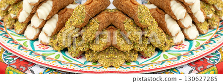 Cannoli with pistachios and ricotta. Sicilian dessert cannolo, fresh sweet cannoli pile 130627285