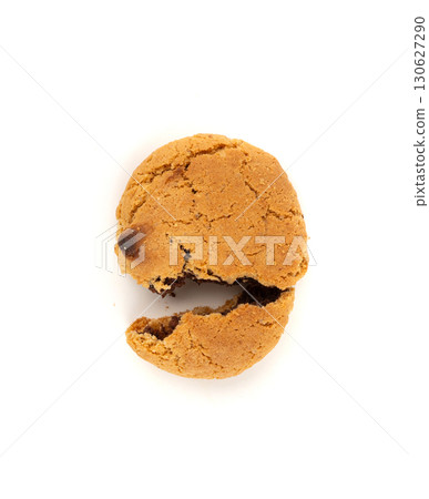Crumbled chocolate cookies with chocolate filling isolated, brown round biscuits pieces 130627290
