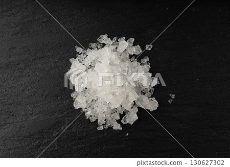 Dead sea salt pile, white crystals for body spa, sodium chloride similar to crushed ice, spa scrub 130627302