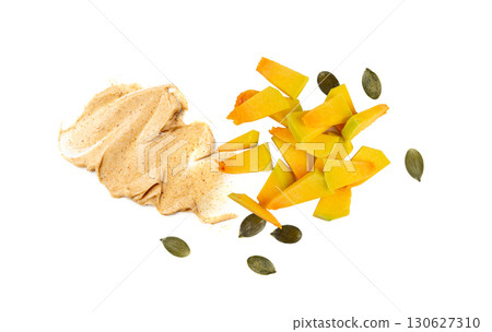 Yellow pumpkin scrub texture smear isolated. Creamy face cosmetic swatch Yellow pumpkin scrub texture smear isolated. Creamy face cosmetic swatch 130627310