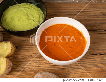 Red mojo rojo and green mojo verde sauces, traditional Tenerife dips, mojo picon dressing 130627325