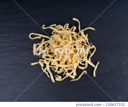Passatelli spatzle pasta pile, raw spaetzle noodles, dry homemade german macaroni, swabian spaetzle Passatelli spatzle pasta pile, raw spaetzle noodles, dry homemade german macaroni, swabian spaetzle 130627332