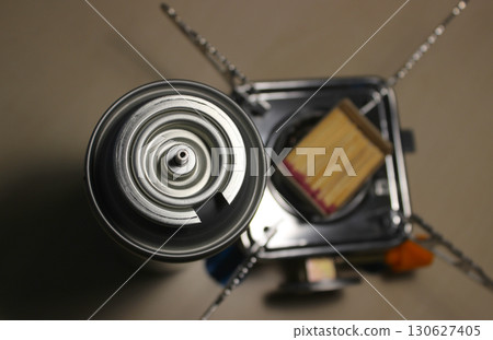 Folding Burner, Gas Cylinder And Safety Matches. Camping Equipment For Outdoor Cooking 130627405