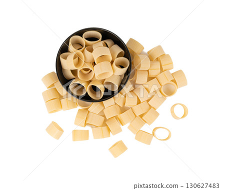 Raw Calamarata Big Pasta Isolated, Homemade Dry Macaroni, Italian Raw Round Noodle 130627483