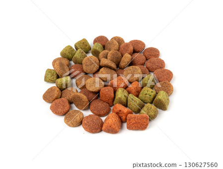 Dry pet food, dog color kibble pile, puppy meat and vegetable pellets, canine protein granules Dry pet food, dog color kibble pile, puppy meat and vegetable pellets, canine protein granules 130627560