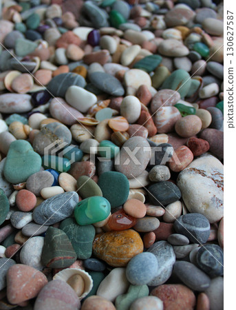 Vertical Stock Photo Of Sea Stones, Colored Quartz Stones And Seashells With Soft Focus   130627587