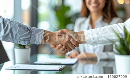 Businessmen shaking hands at a meeting Businessmen shaking hands at a meeting 130627909