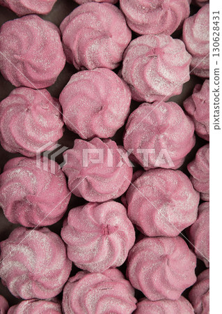 Pink homemade marshmallow candies in rows. Sweet dessert background, top view Pink homemade marshmallow candies in rows. Sweet dessert background, top view 130628431
