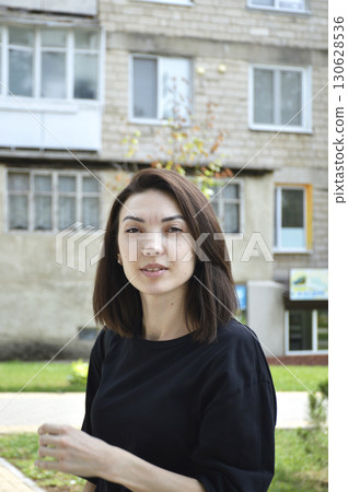 Beautiful woman with bob haircut looks attentively Beautiful woman with bob haircut looks attentively 130628536