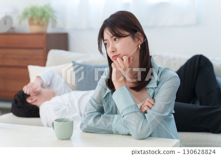 A lazy husband on a holiday and a dissatisfied wife 130628824