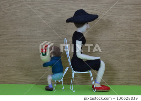 Child and woman holding bouquets 130628839