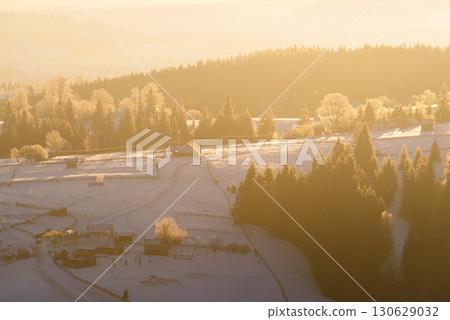 Winter Mountain Village At Sunrise With Snowy Slopes And Frosted Trees Winter Mountain Village At Sunrise With Snowy Slopes And Frosted Trees 130629032