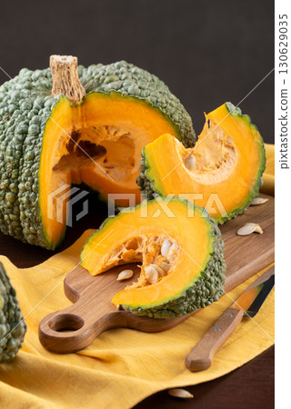 Buen Gusto de Horno Squash With Wedges On Kitchen Table Buen Gusto de Horno Squash With Wedges On Kitchen Table 130629035