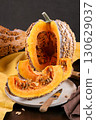 Cut Musquee De Maroc Pumpkin With Orange Flesh On Kitchen Table 130629037