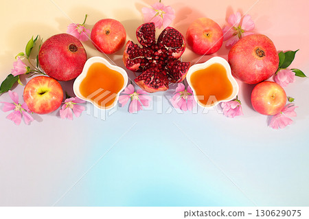Autumn background with honey, apples, pomegranate and flowers, advertising banner with symbols of the Jewish New Year, . Creative composition for congratulations on the Jewish holiday Ro hashanah. Autumn background with honey, apples, pomegranate and flowers, advertising banner with symbols of the Jewish New Year, . Creative composition for congratulations on the Jewish holiday Ro hashanah. 130629075