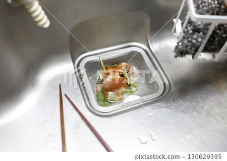 Food waste and drain net in the kitchen sink 130629395