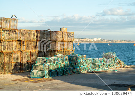 Crab Traps Stacked Along the Dock Near the Harbor 130629474